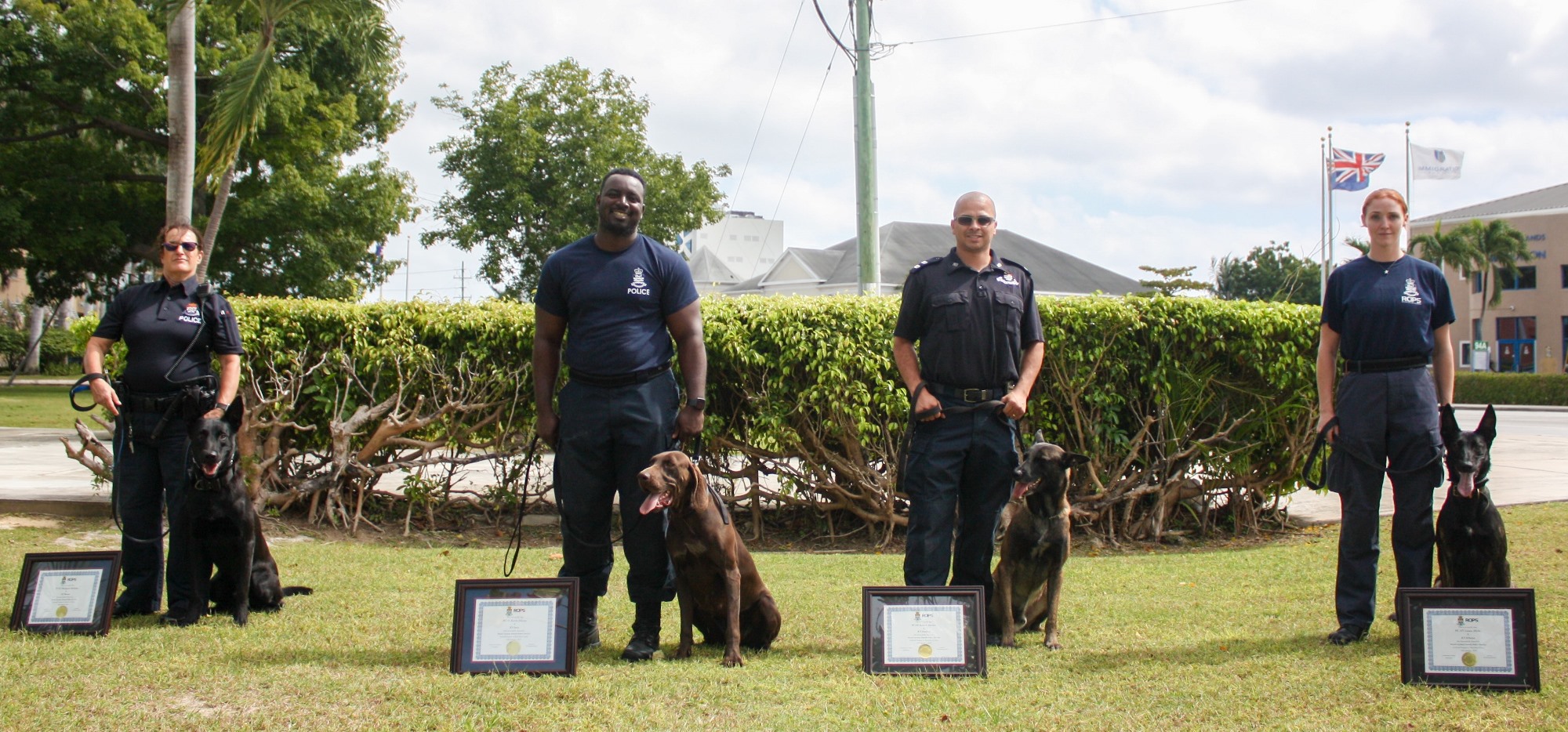 The K-9 officers pose with their dogs.